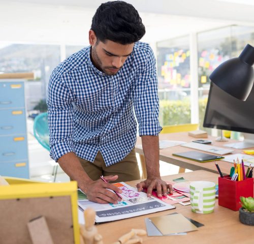 male-graphic-designer-working-at-desk-2021-08-28-16-46-19-utc.jpg